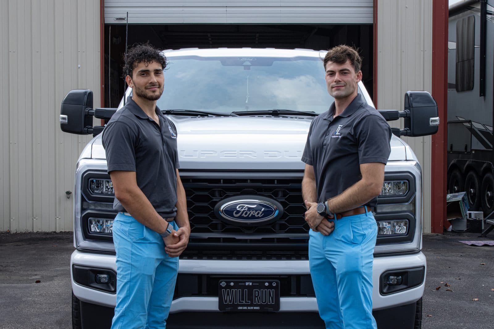 BLU crew members with a company truck