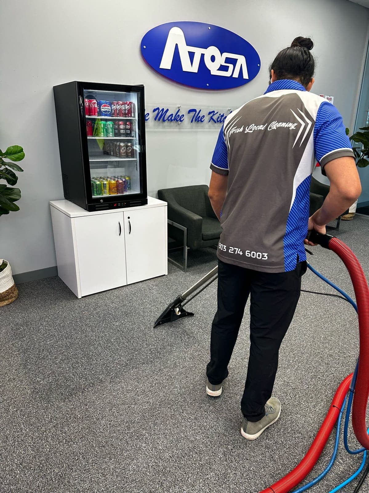BLU crew member extracting carpet at a commercial client