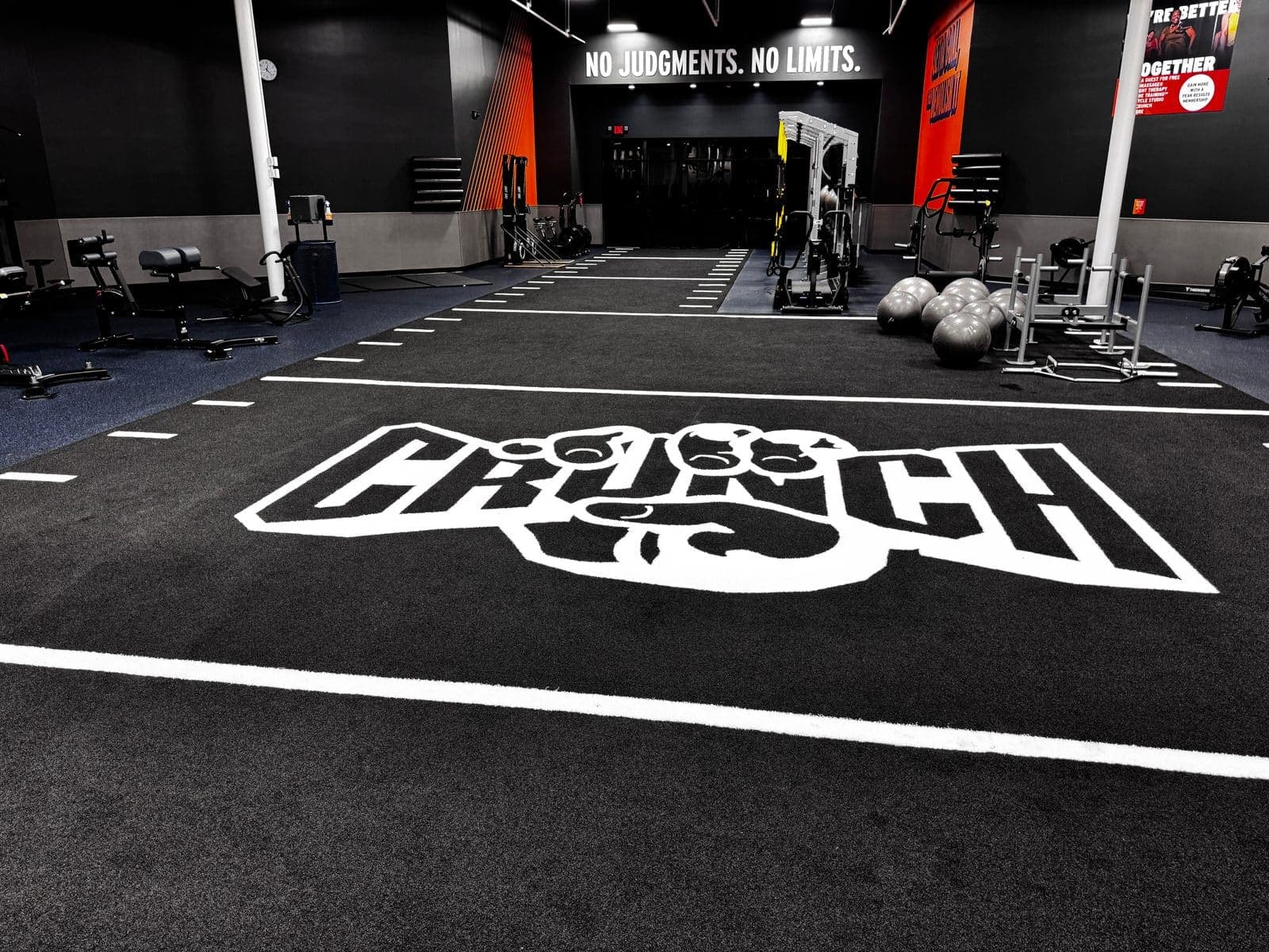 Crunch Fitness turf zone with inlaid logo, spotless after BLU turnover
