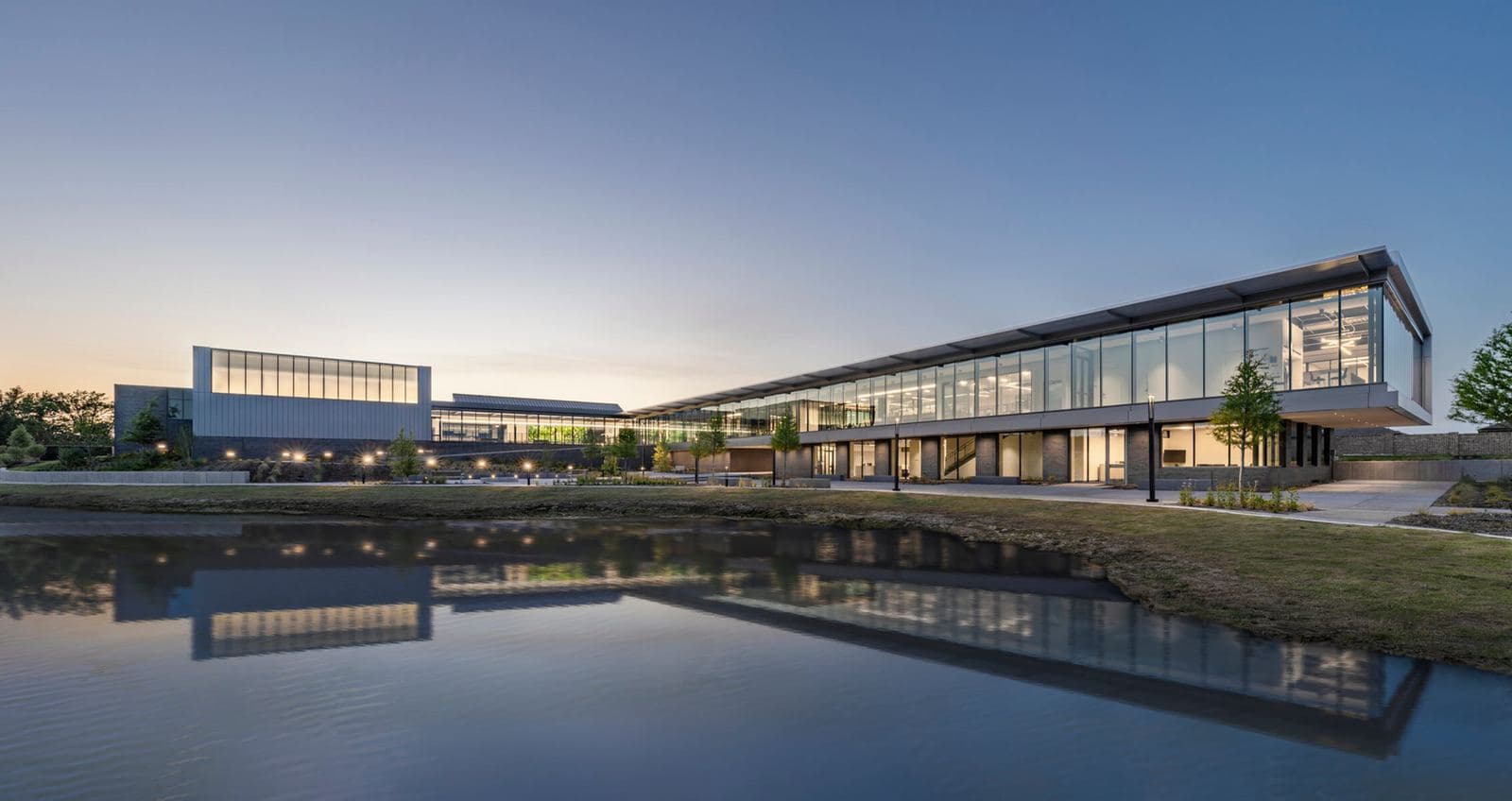 Princeton Municipal Center's glass facade at dusk, maintained by BLU