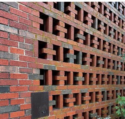 Stained brick on the ETAMU art building before cleaning